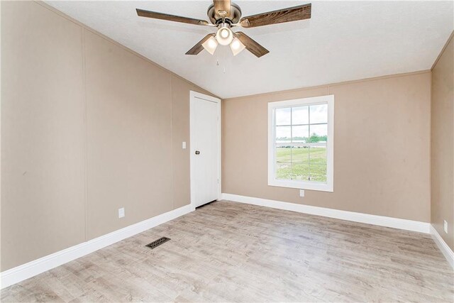 32536 D Wascom Rd, Mount Hermon, LA 70450 - unfurnished room with a ceiling fan, visible vents, vaulted ceiling, wood finished floors, and baseboards