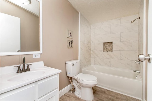 32536 D Wascom Rd, Mount Hermon, LA 70450 - bathroom with vanity, wood finished floors, bathing tub / shower combination, toilet, and a textured ceiling