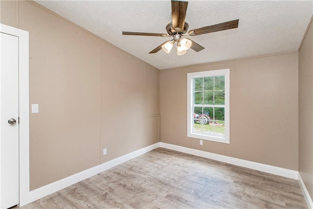 32536 D Wascom Rd, Mount Hermon, LA 70450 - empty room with a ceiling fan, a textured ceiling, baseboards, and light wood finished floors
