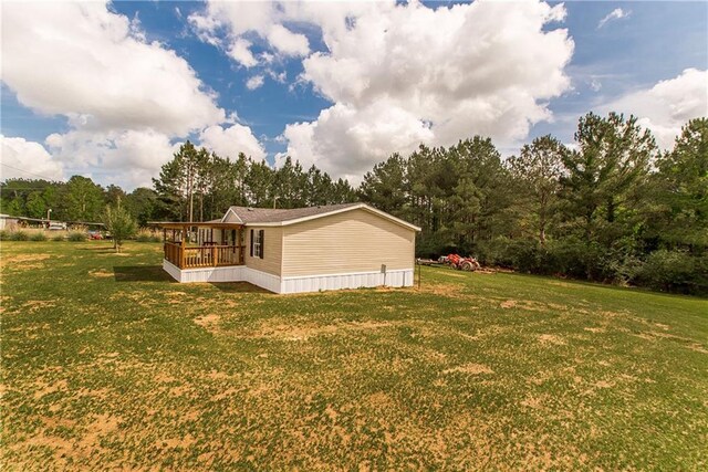 32536 D Wascom Rd, Mount Hermon, LA 70450 - view of property exterior with a sunroom and a yard