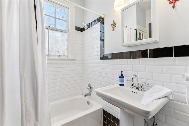 1818 Paul Morphy St, New Orleans, LA 70119 - full bathroom with a sink, shower / tub combo with curtain, and tile walls