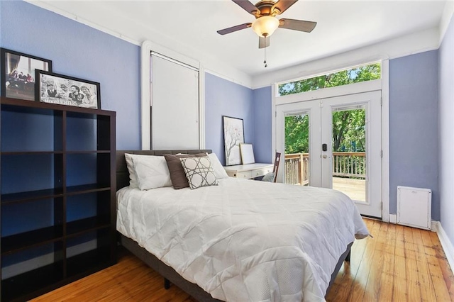 1818 Paul Morphy St, New Orleans, LA 70119 - bedroom with ceiling fan, access to outside, french doors, and wood finished floors