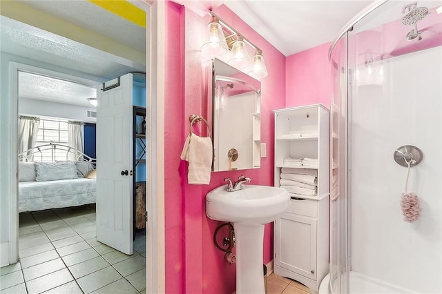1818 Paul Morphy St, New Orleans, LA 70119 - bathroom featuring visible vents, ensuite bathroom, tile patterned flooring, and a stall shower