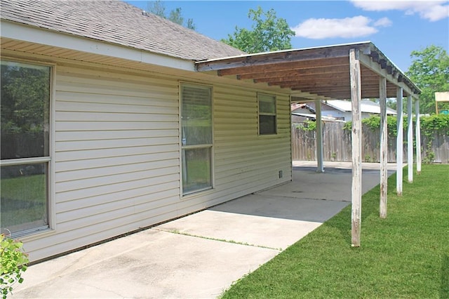 57288 Beech Ave, Slidell, LA 70461 - view of patio / terrace with fence and a carport