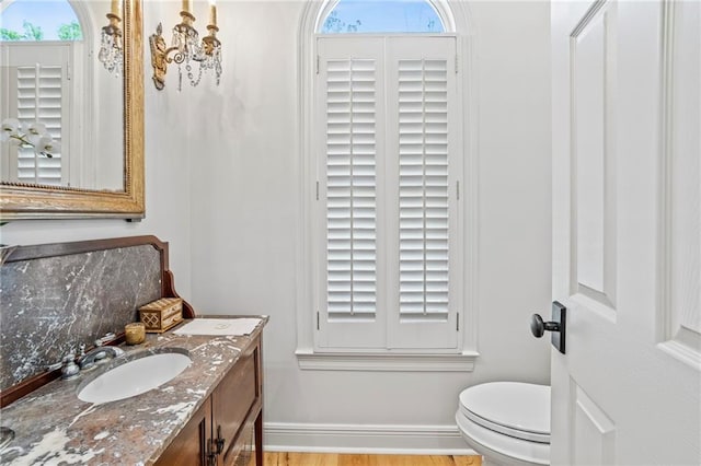 34 Riverdale Dr, Covington, LA 70433 - bathroom with toilet, healthy amount of natural light, and vanity