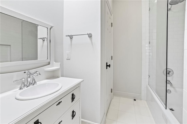 34 Riverdale Dr, Covington, LA 70433 - bathroom with tub / shower combination, vanity, tile patterned floors, and baseboards