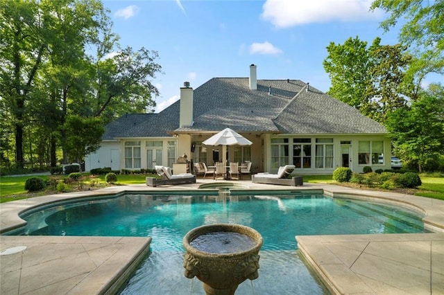 34 Riverdale Dr, Covington, LA 70433 - view of pool featuring a pool with connected hot tub, a patio area, and french doors