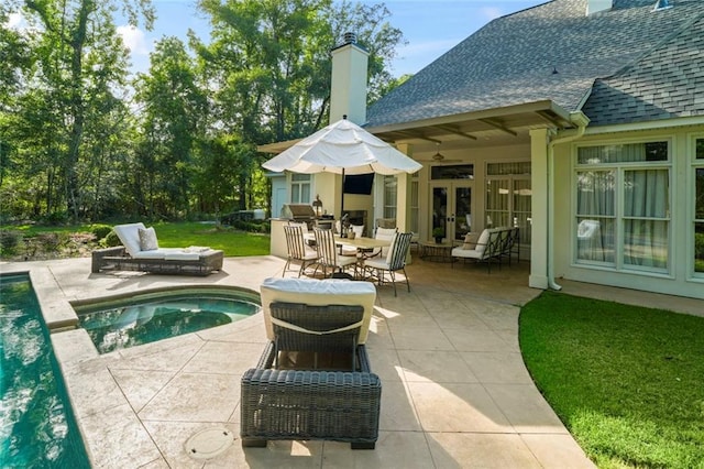 34 Riverdale Dr, Covington, LA 70433 - outdoor pool featuring french doors, a patio, and an in-ground hot tub