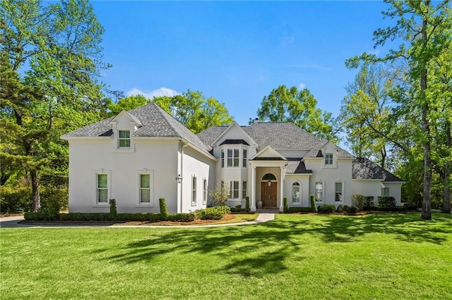 34 Riverdale Dr, Covington, LA 70433 - french country inspired facade with a front yard and stucco siding
