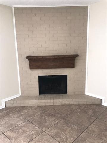 47 Birdie Dr Unit 7, Slidell, LA 70460 - room details with a brick fireplace and baseboards