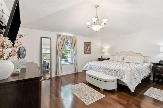 2004 Harvard Ave, Metairie, LA 70001 - bedroom with a chandelier, vaulted ceiling, and wood finished floors