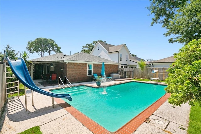 2004 Harvard Ave, Metairie, LA 70001 - view of pool with a water slide, a patio, and a fenced backyard