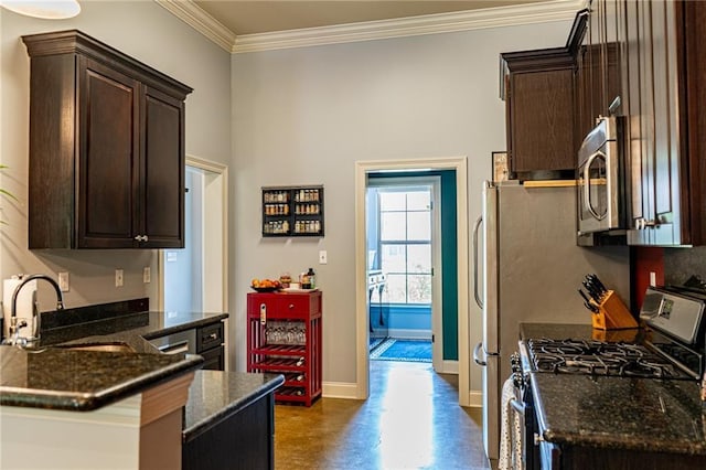 47135 Vineyard Trce, Hammond, LA 70401 - kitchen featuring crown molding, dark brown cabinetry, baseboards, a sink, and appliances with stainless steel finishes
