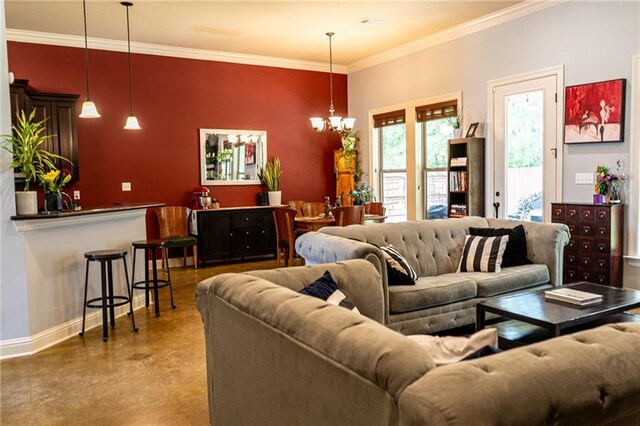 47135 Vineyard Trce, Hammond, LA 70401 - living area with crown molding, baseboards, and a notable chandelier