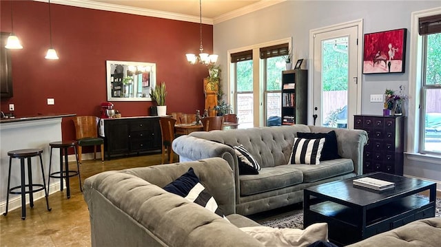 47135 Vineyard Trce, Hammond, LA 70401 - living area featuring a chandelier and ornamental molding