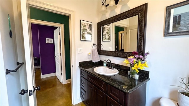 47135 Vineyard Trce, Hammond, LA 70401 - bathroom with finished concrete flooring, vanity, and baseboards