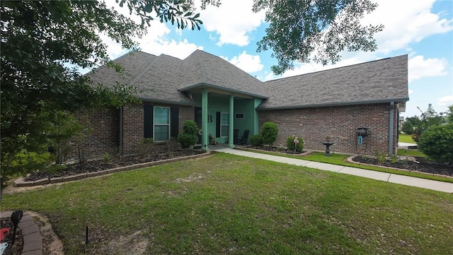 318 Saw Grass Loop, Covington, LA 70435 - view of front of house featuring brick siding, a front lawn, and a shingled roof