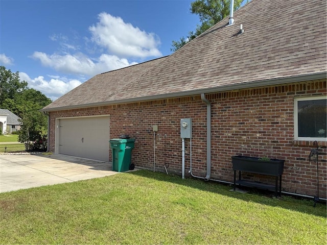318 Saw Grass Loop, Covington, LA 70435 - view of home's exterior featuring roof with shingles, driveway, a garage, a lawn, and brick siding