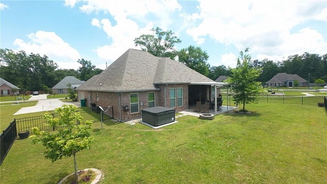 318 Saw Grass Loop, Covington, LA 70435 - back of property with brick siding, a patio, an outdoor fire pit, and a shingled roof