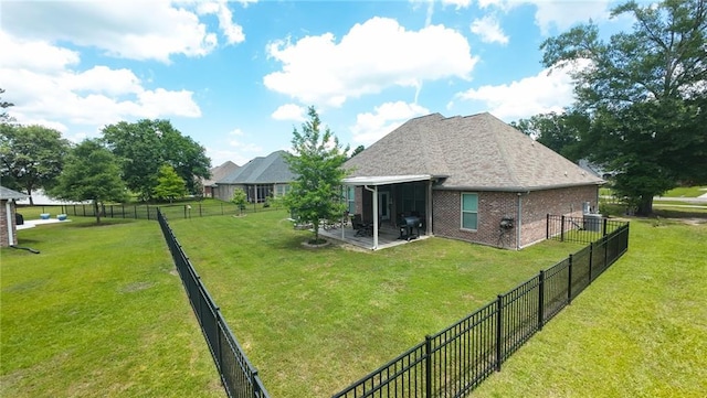 318 Saw Grass Loop, Covington, LA 70435 - back of house featuring brick siding and a patio