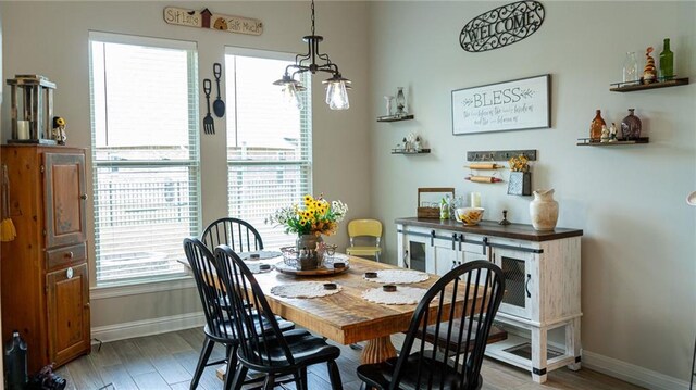 318 Saw Grass Loop, Covington, LA 70435 - dining area featuring baseboards and light wood-style floors