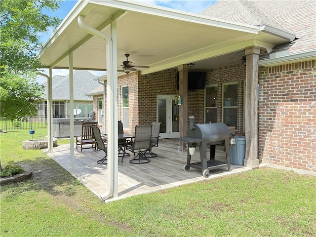 318 Saw Grass Loop, Covington, LA 70435 - deck with a hot tub, a ceiling fan, and a patio area