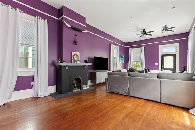 235 Belleville St, New Orleans, LA 70114 - living room with baseboards, a ceiling fan, and hardwood / wood-style flooring