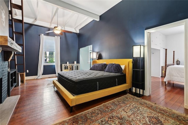 235 Belleville St, New Orleans, LA 70114 - bedroom with hardwood / wood-style floors, beam ceiling, high vaulted ceiling, a fireplace, and baseboards