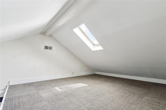 235 Belleville St, New Orleans, LA 70114 - bonus room with carpet, visible vents, baseboards, and vaulted ceiling with skylight
