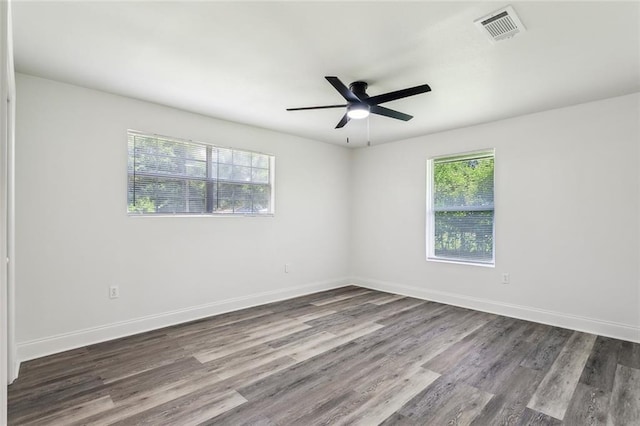 418 E 35th Ave, Covington, LA 70433 - unfurnished room featuring visible vents, baseboards, ceiling fan, and wood finished floors