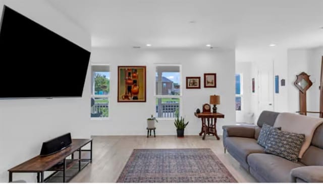 542 Abalon Ct, New Orleans, LA 70114 - living room featuring light wood-style floors and recessed lighting