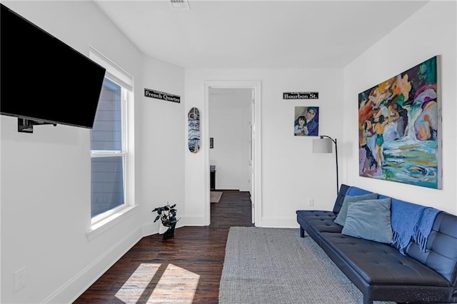 542 Abalon Ct, New Orleans, LA 70114 - living room with dark wood-style flooring and baseboards