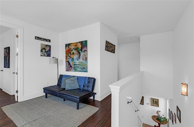 542 Abalon Ct, New Orleans, LA 70114 - sitting room with an upstairs landing, dark wood finished floors, and baseboards