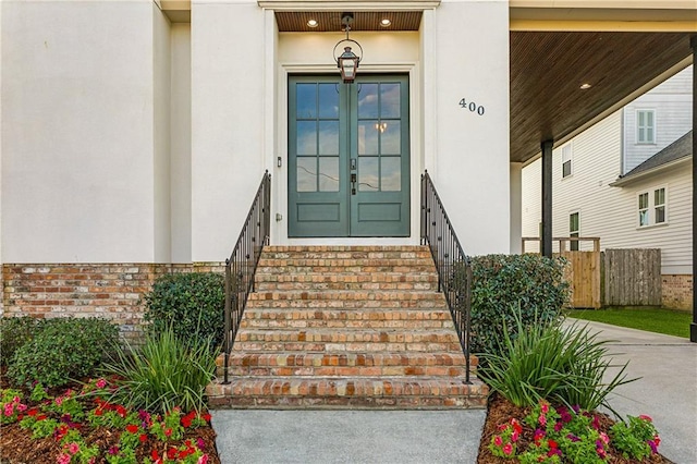 400 40th St, New Orleans, LA 70124 - view of exterior entry with stucco siding, french doors, and brick siding