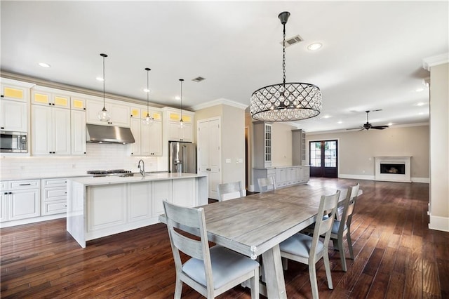 400 40th St, New Orleans, LA 70124 - dining space featuring ceiling fan, ornamental molding, recessed lighting, baseboards, and dark wood-style floors