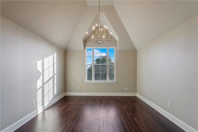 400 40th St, New Orleans, LA 70124 - additional living space with a chandelier, dark wood-style floors, lofted ceiling, and baseboards