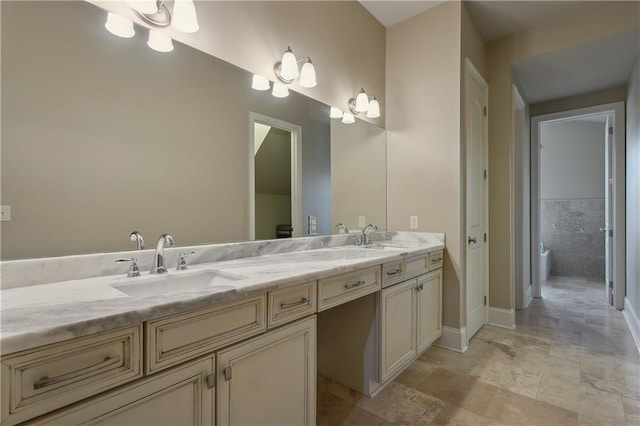 400 40th St, New Orleans, LA 70124 - full bathroom featuring a chandelier, double vanity, baseboards, and stone finish floors