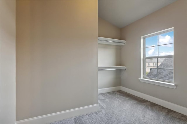 400 40th St, New Orleans, LA 70124 - spacious closet featuring carpet flooring and vaulted ceiling