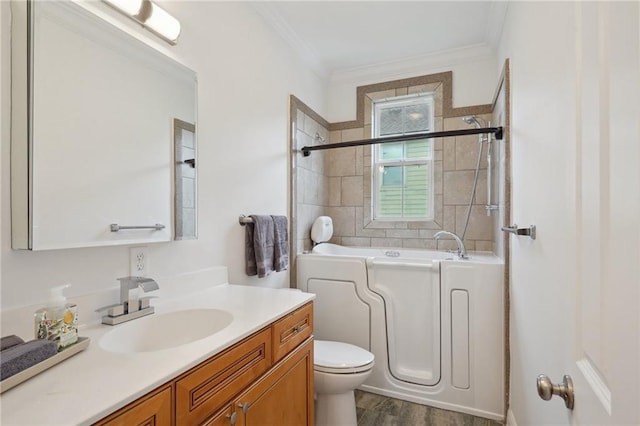 full bath featuring crown molding, toilet, and vanity