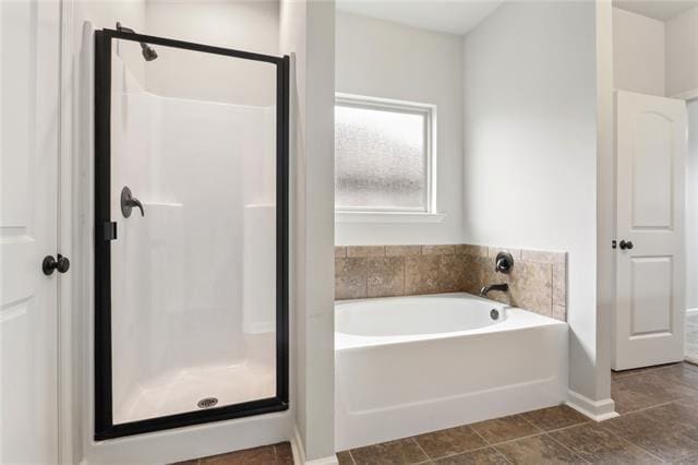 324 Ashton Oaks Ln, Luling, LA 70070 - full bath with a shower stall, a garden tub, baseboards, and tile patterned flooring