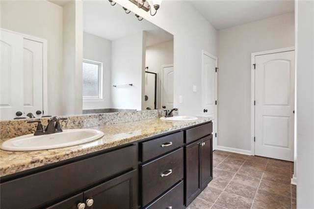 324 Ashton Oaks Ln, Luling, LA 70070 - full bathroom with double vanity, a stall shower, and baseboards