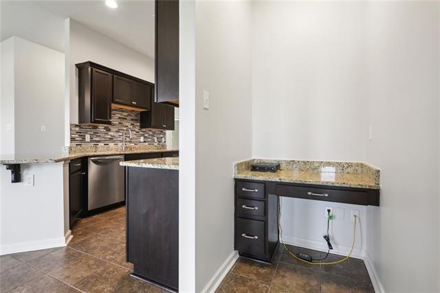 324 Ashton Oaks Ln, Luling, LA 70070 - kitchen featuring stainless steel dishwasher, baseboards, tasteful backsplash, dark brown cabinetry, and recessed lighting