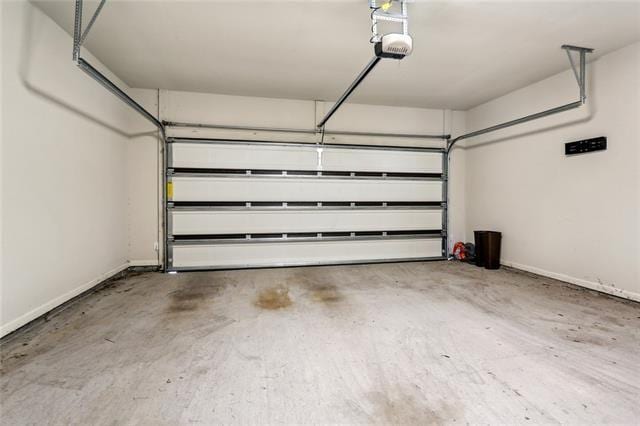 324 Ashton Oaks Ln, Luling, LA 70070 - garage featuring baseboards and a garage door opener