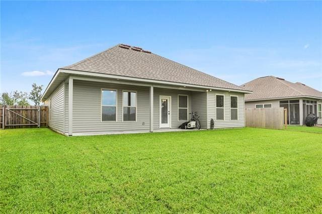 324 Ashton Oaks Ln, Luling, LA 70070 - back of property featuring a shingled roof