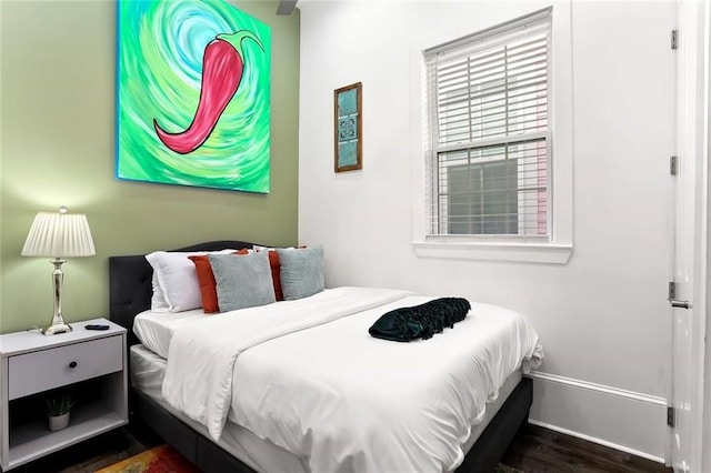 624-626 S Lopez St, New Orleans, LA 70119 - bedroom featuring baseboards and dark wood finished floors