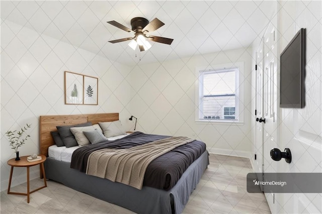 bedroom featuring baseboards and a ceiling fan