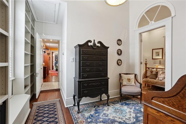 1907 N Rampart St, New Orleans, LA 70116 - sitting room with attic access, wood finished floors, and baseboards
