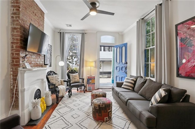 1907 N Rampart St, New Orleans, LA 70116 - living area featuring crown molding, a ceiling fan, visible vents, and wood finished floors