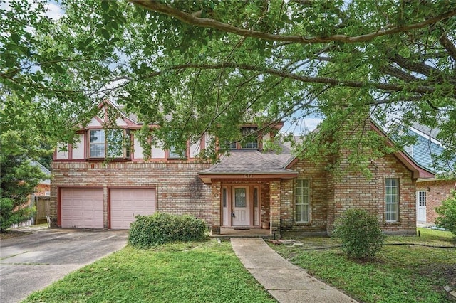 view of front of home with a garage, a front lawn, brick siding, a shingled roof, and driveway