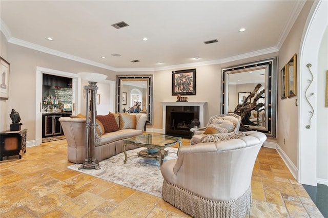 living room with baseboards, visible vents, recessed lighting, and stone tile floors